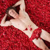 The Bachelor Honey Badger lying in our Red Passion Freeze Dried Rose Petals